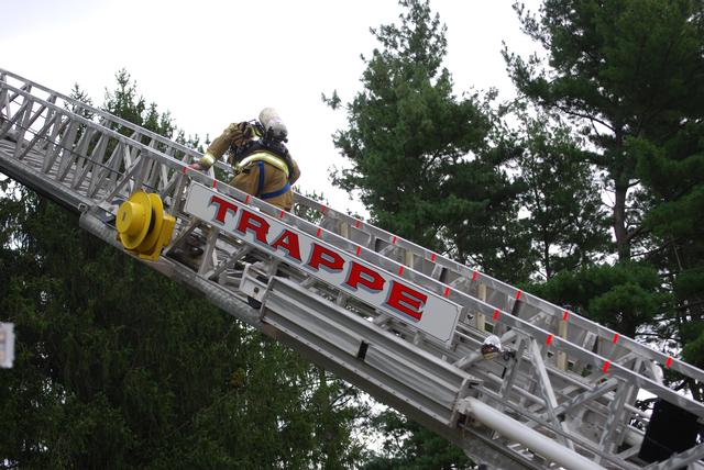 Assistant Chief John Bolger making his way to the top of Ladder 77
